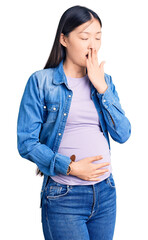 Poster - Young beautiful chinese woman pregnant expecting baby bored yawning tired covering mouth with hand. restless and sleepiness.