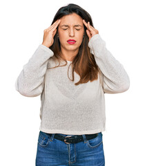 Canvas Print - Beautiful hispanic woman wearing casual sweater with hand on head for pain in head because stress. suffering migraine.