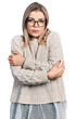 © Krakenimages.com - Young blonde woman wearing glasses shaking and freezing for winter cold with sad and shock expression on face