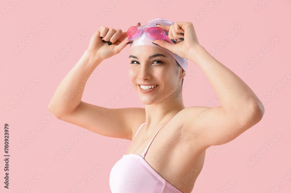 Female swimmer on pink background, closeup