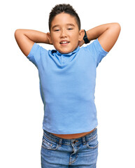 Canvas Print - Little boy hispanic kid wearing casual clothes relaxing and stretching, arms and hands behind head and neck smiling happy