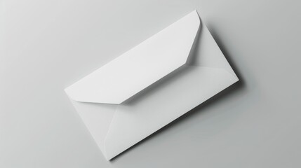 Poster - Simple white envelope on a plain gray background. Suitable for business or communication concepts