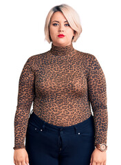 Wall Mural - Young blonde plus size woman wearing casual leopard t-shirt with serious expression on face. simple and natural looking at the camera.