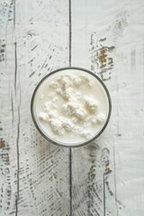 Poster - Fresh glass of milk on rustic wooden table, suitable for food and beverage themes