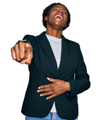 Wall Mural - Young african american girl wearing business clothes laughing at you, pointing finger to the camera with hand over body, shame expression