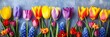 A vibrant display of spring tulips and hyacinths in full bloom, showcasing a spectrum of colors against a textured blue background.