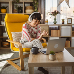 mature woman businesswoman have video call use laptop at home