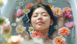 young asian woman relaxing in a floral bath with floating fresh flowers