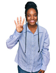 Wall Mural - Young african american woman wearing casual clothes showing and pointing up with fingers number four while smiling confident and happy.