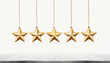 Photo of little stars hanging on thread with place for five stars isolated white background with empty space