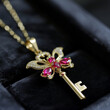 Gold Key Pendant with Pink Stones

