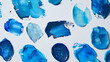a captivating array of blue paint smears on a pristine white background.