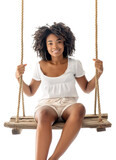 Fototapeta  - Gorgeous Afro American young lady sitting and posing in wooden swing over white transparent background