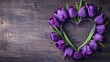 Fresh purple tulip flowers heart shape isolated on wooden background with copy space, Mother's Day, Valentine's Day backgrounds.