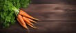 Fresh orange carrots arranged neatly on a weathered wooden table, creating a simple and natural composition