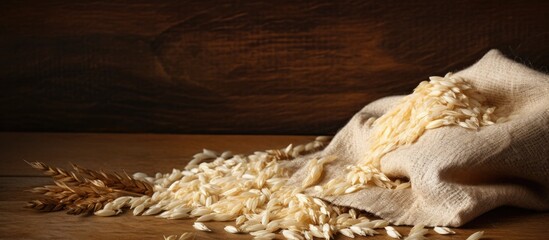 Canvas Print - A detailed view of a sack filled with rice and several wheat ears