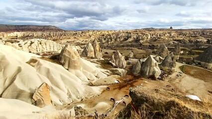 Wall Mural - Cappadocia, Turkey. Panoramic view of the mountains in Goreme national park. Beautiful landscape at sunrise. Famous travel destination. 
