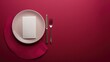 Elegant table setting with white square plate, cutlery, and pink napkin on maroon background