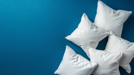 Canvas Print - Three white pillows on a blue background