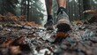 Intimate look at trail running shoes on a wet, muddy route, rain adding to the drama of the outdoor challenge