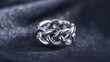 Elegant 925 sterling silver ring design on a soft backdrop. A luxurious and intricately designed ring stands out against a creamy, soft background, bathed in gentle light