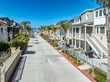 California real estate, San Diego Mission Beach street lined with luxury real estate properties with covered porch