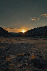 Poster - A scenic view of the sun setting behind mountains. Suitable for various outdoor and nature-themed projects
