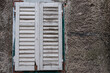 Shutter closed over old window