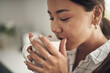 © peopleimages.com - Woman and drinking cup of coffee at home in the kitchen with caffeine for breakfast. Female person, beverage and enjoying fresh, brewed drink and morning fix to feel energy, relaxed and refreshed