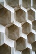 Embossed geometric design, subtle 3D effect, light and shadow play