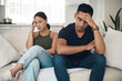 Divorce, stress or couple fight on sofa with headache, anxiety or frustrated by liar, fail or drama at home. Marriage, conflict or asian people argue in living room with fear, overthinking or mistake