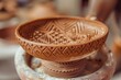 View of a clay dish imprinted with intricate geometric patterns by a DIY clay stamp, highlighting the craftsmanship involved