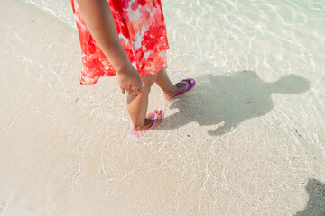 Wall Mural - Walking and relaxing on the beach