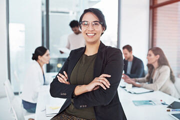 Wall Mural - Professional woman, portrait and pride at desk for leadership, motivation and startup company. Team, planning and management in workplace for career, staff and businesswoman with glasses in office.