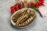 Fototapeta Kuchnia - Grilled tasty ripe eggplant slice