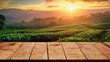empty wooden table with tea plantation as background