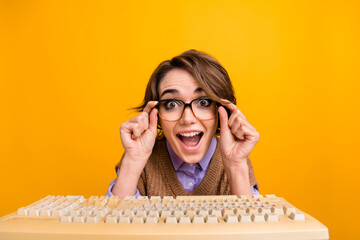 Poster - Photo portrait of attractive young woman keyboard amazed react web camera dressed retro office clothes isolated on yellow color background