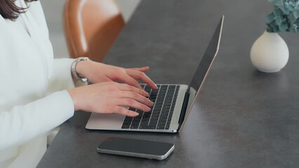 Aufkleber - A woman using a laptop PC indoors