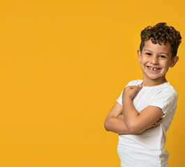 Wall Mural - Smiling boy standing on yellow background
