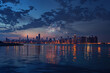 4th of July serenity: Fireworks twinkle over Chicago's dusk-lit skyline and calm waters