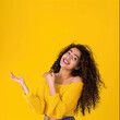 © Olya Fedorova - Smiling girl standing on yellow background