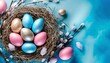 easter holiday celebration golden and pastell blue and pink eggs on bird nest on bright blue background top view with space for text and design greeting card banner