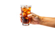 Hands holding a refreshing glass of cola with ice cubes