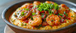 Shrimp and Grits dish from the southern United States, shrimp and grits feature creamy grits topped with shrimp, bacon, onions, garlic, and often garnished with green onions and grated cheese 