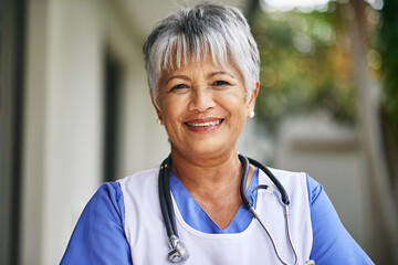 Poster - Face, woman and senior nurse with pride outdoor for healthcare, hospice and sick. Medical care, stethoscope and Portrait of mature female worker at clinic for helping elderly, smile and confidence