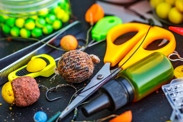 Carpfishing session at the Lake.fishing tools, scissors, carp bait,mixed in dips and stickbaits.Carp fishing rig.The Boilies with fishing hook.