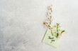 © ADDICTIVE STOCK - Cherry blossom branches over a thank you card