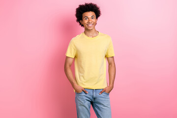 Canvas Print - Photo of cheerful good mood guy dressed yellow t-shirt smiling hands arms pockets isolated pink color background