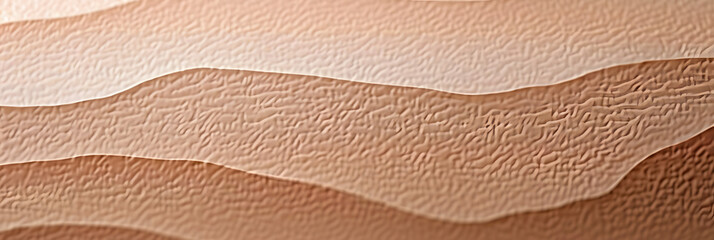 Sticker - A close up of a piece of paper displaying shades of brown, beige, and grey resembling a wood flooring pattern with a peach tint and textured landscape. The font is unique