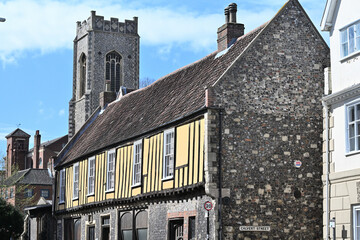 Tudor style yellow house and Norfolk flint in Norwich town centre